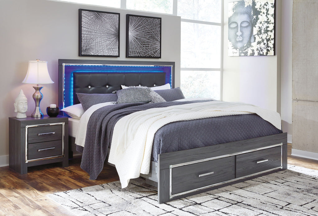 Gray upholstered panel bed with button-tufted headboard and two drawers