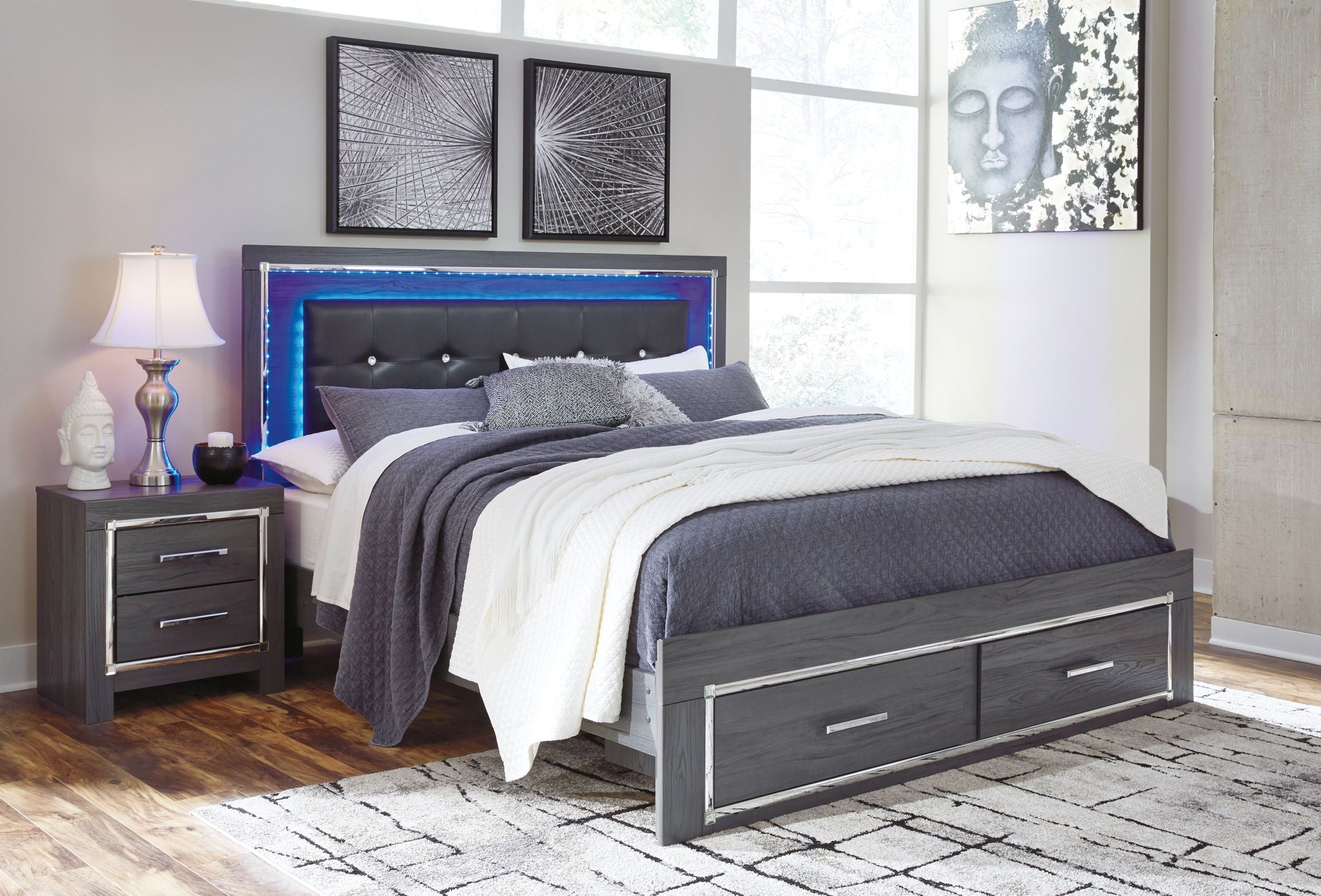 Gray upholstered panel bed with button-tufted headboard and two drawers