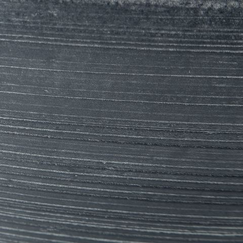 Meadie bowl ceramic surface close-up, dark blue charcoal texture