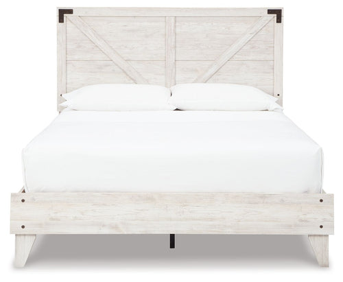 White panel bed with light wood finish, paneled headboard and footboard, white bedding