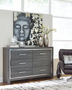 Dark gray dresser with mirror panel and six drawers, each with silver bar handles