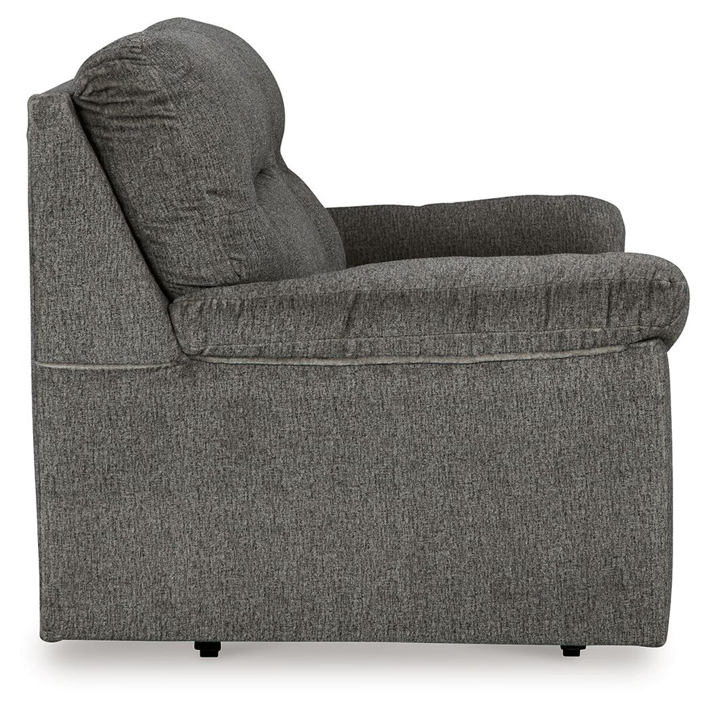Glider loveseat side view, dark gray fabric with rounded arms and thick back cushion