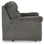 Glider loveseat side view, dark gray fabric with rounded arms and thick back cushion
