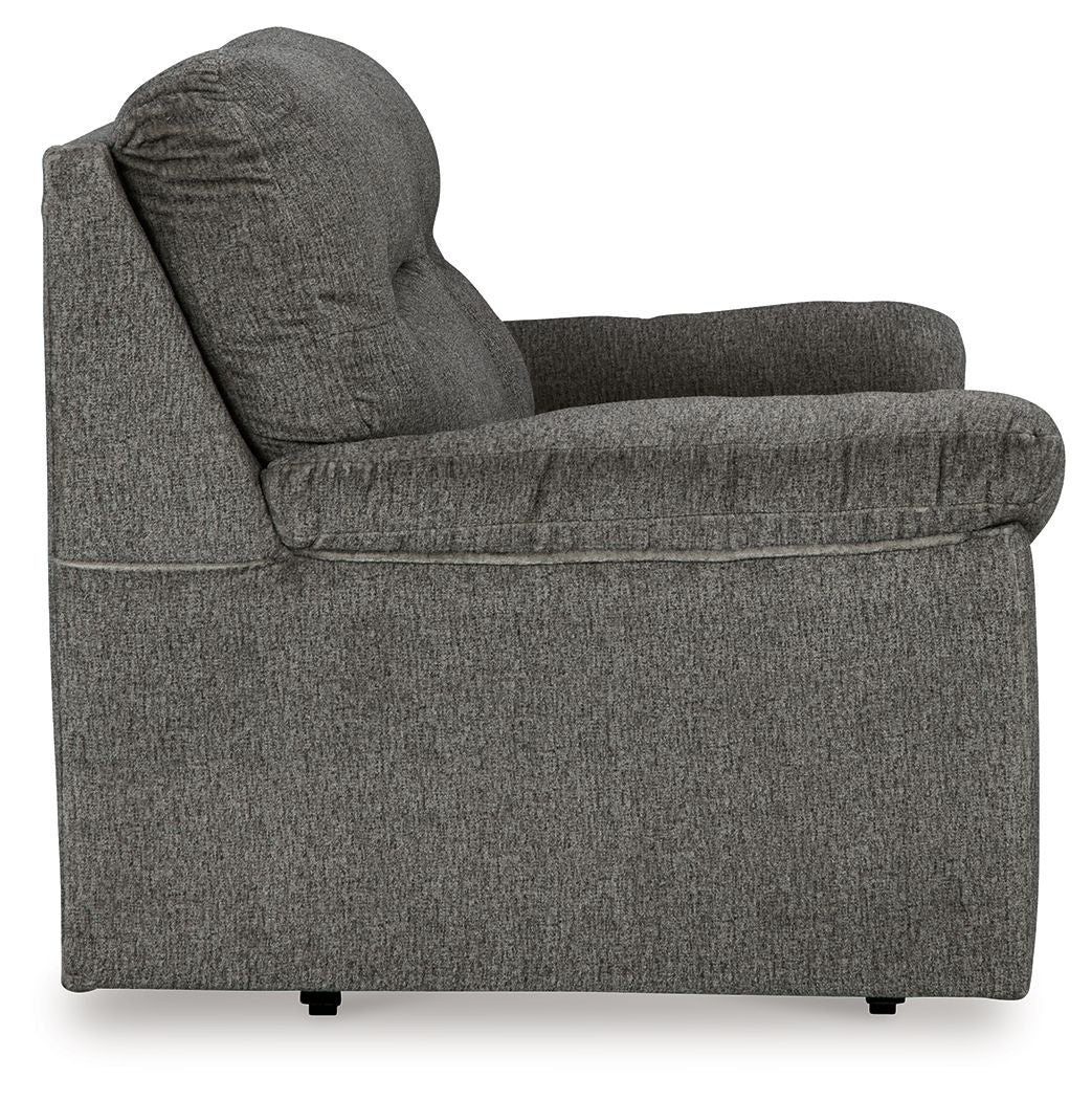 Glider loveseat side view, dark gray fabric with rounded arms and thick back cushion