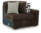 Chocolate corduroy right-arm corner chair with light and patterned throw pillows