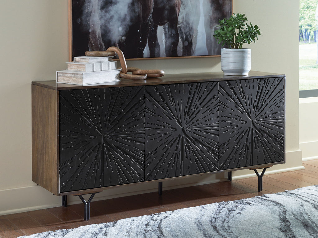 Low cabinet with dark embossed starburst front, wood sides, tapered metal legs.