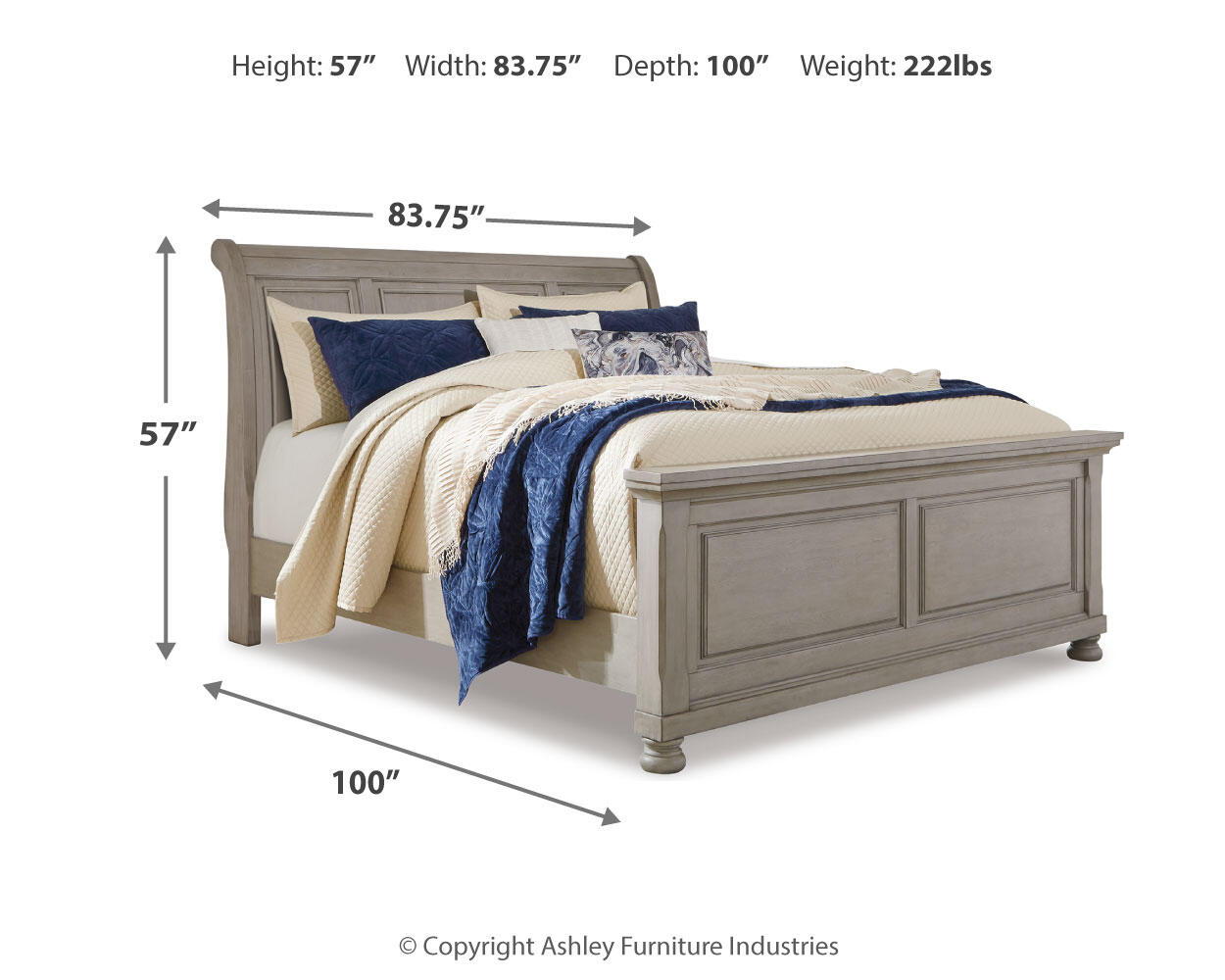 Lettner sleigh bed headboard detail with quilted blue and cream pillows