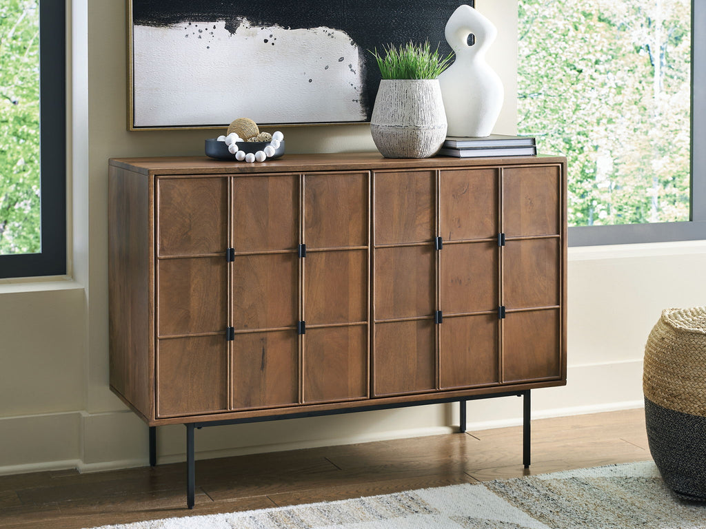 Brown accent cabinet with multiple door sections and black knobs, side view