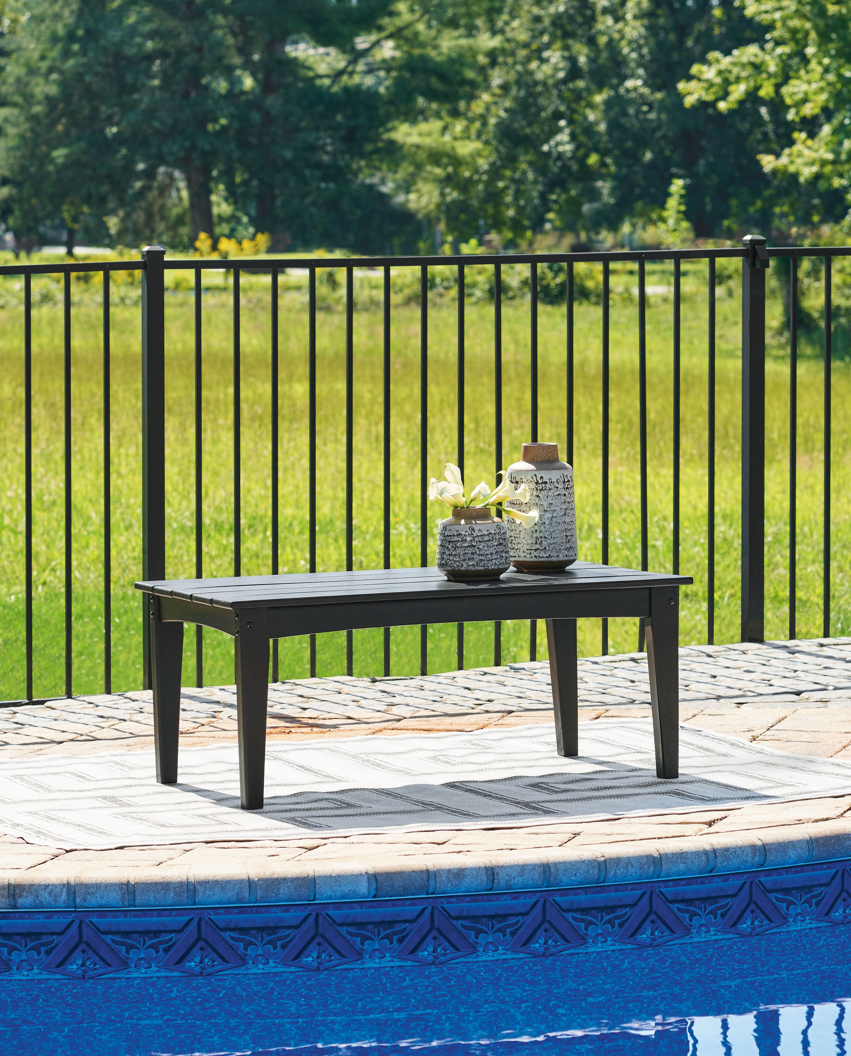 Rectangular cocktail table in dark/black with slatted top and tapered legs