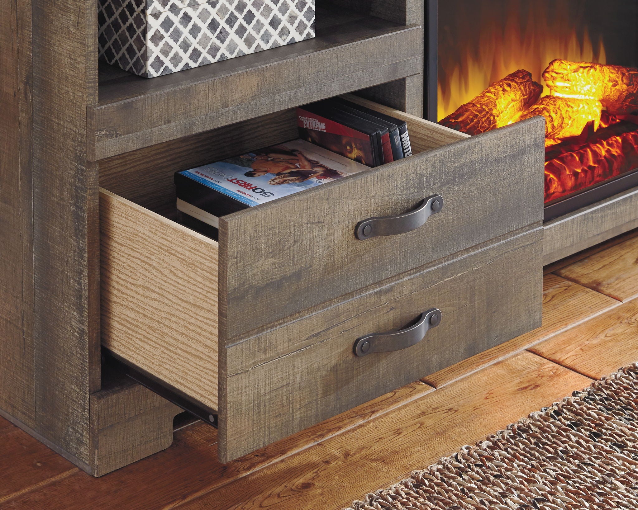 Brown wood TV stand drawer with two pull handles, shelves beside fireplace