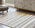 Geometric area rug in pearl silver with dark gray zigzags and lattice diamond pattern