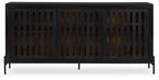 Black accent cabinet with vented slatted front panels and raised legs