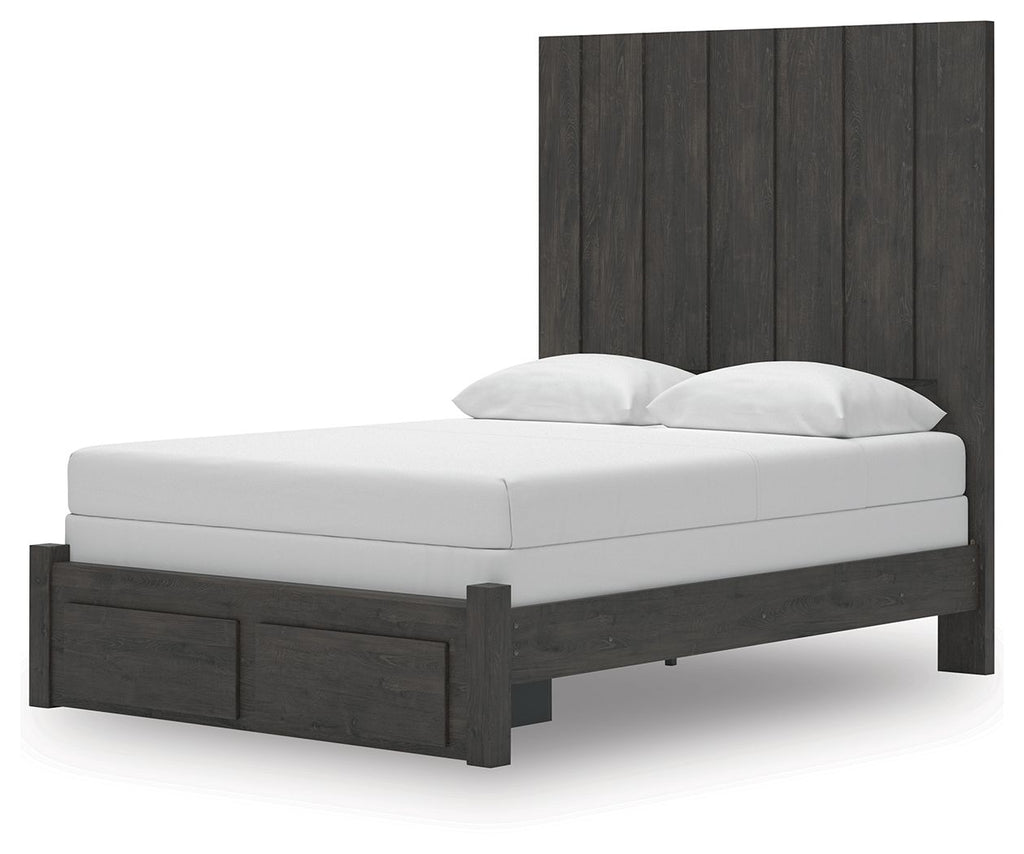 Dark gray panel storage bed frame with white mattress and two pillows, side view
