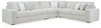 Gray sectional sofa with oversized chaise, tufted cushions and rounded arms