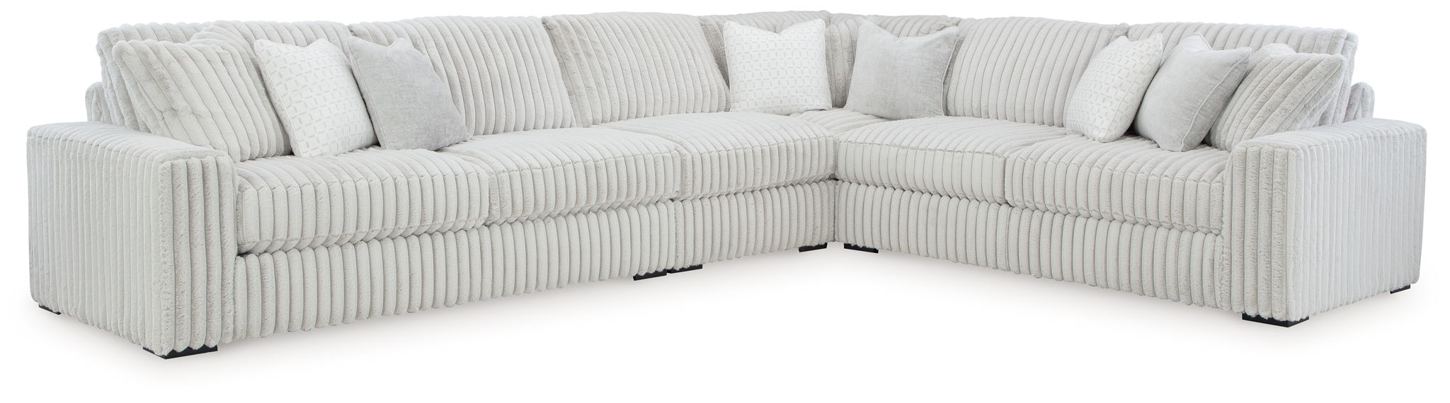 Gray sectional sofa with oversized chaise, tufted cushions and rounded arms