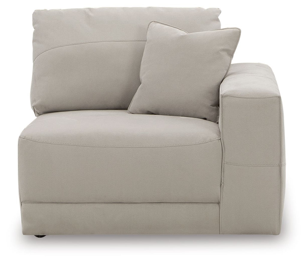 Light gray upholstered corner chair with one seat cushion and two back pillows