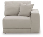 Light gray upholstered corner chair with one seat cushion and two back pillows