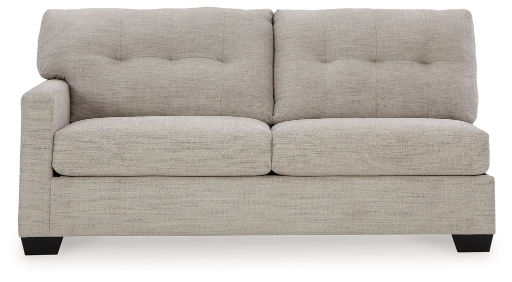 Pebble upholstered sofa with tufted backrest, wide arms, and dark tapered legs