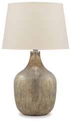 Gray glass table lamp with beige fabric shade and gold-toned base