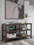 Sofa table with brown frame, gray shelves, and open storage under decor items