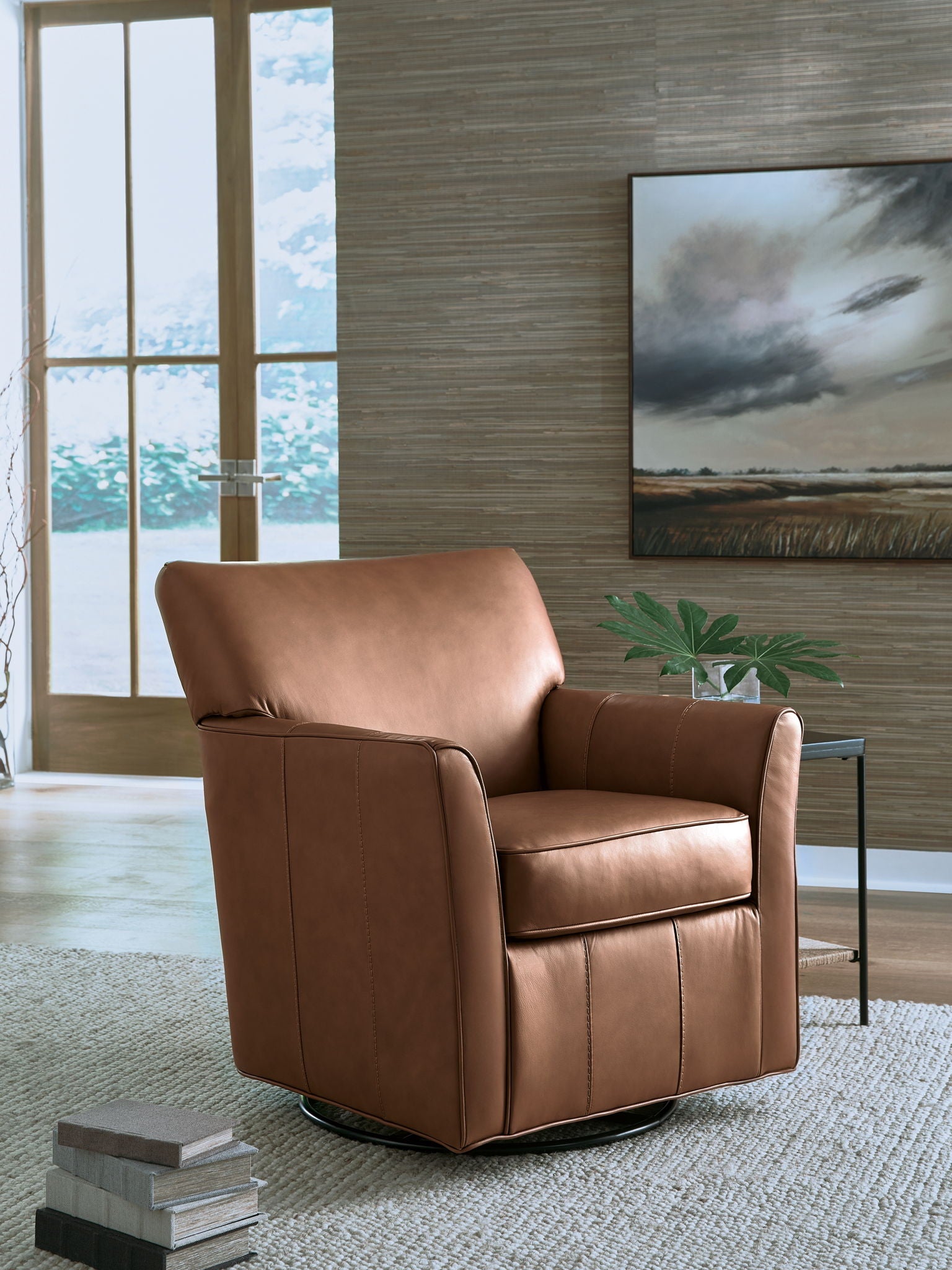 Brown swivel glider accent chair with tall arms, upholstered seat, and smooth back.
