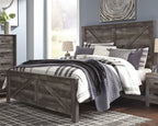 Gray crossbuck panel bed with plaid bedding and pillows