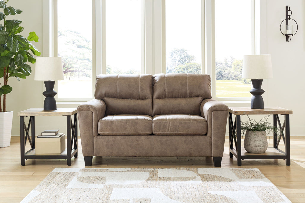 Taupe loveseat with tufted back cushions and padded square arms, dark legs