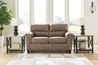 Taupe loveseat with tufted back cushions and padded square arms, dark legs