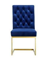Navy velvet tufted dining chair with high back and gold metal base