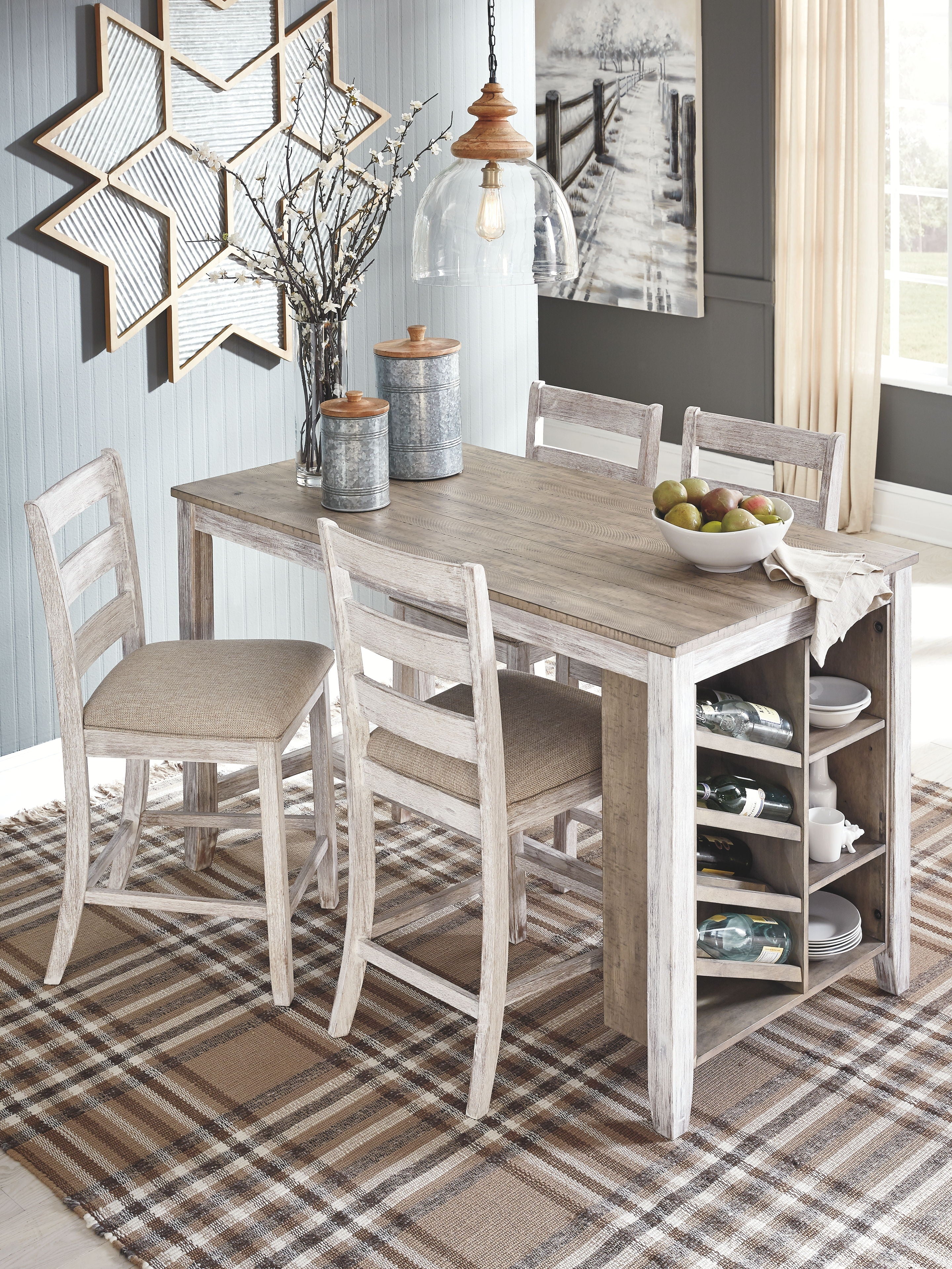 Rectangular counter table with open storage and two barstools with beige upholstered seats