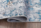 Blue and white rug edge with stitched binding and short pile