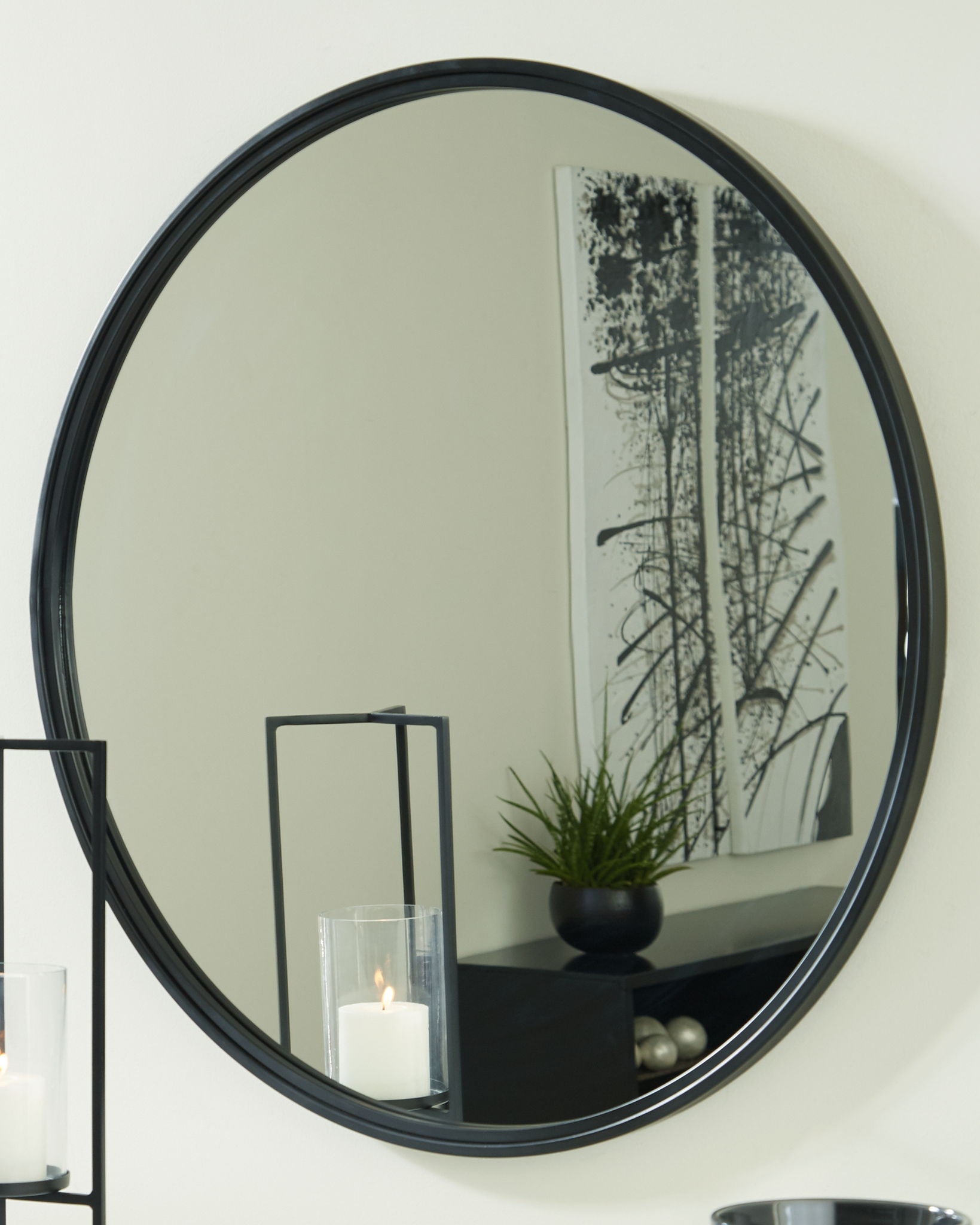 Brocky black round accent mirror with reflective glass and slim frame