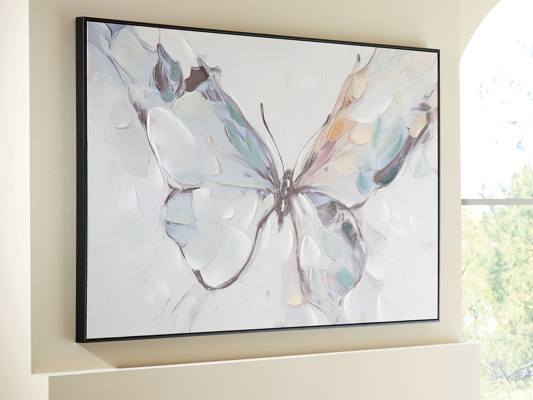 Framed abstract butterfly wall art with pastel wings and dark central body