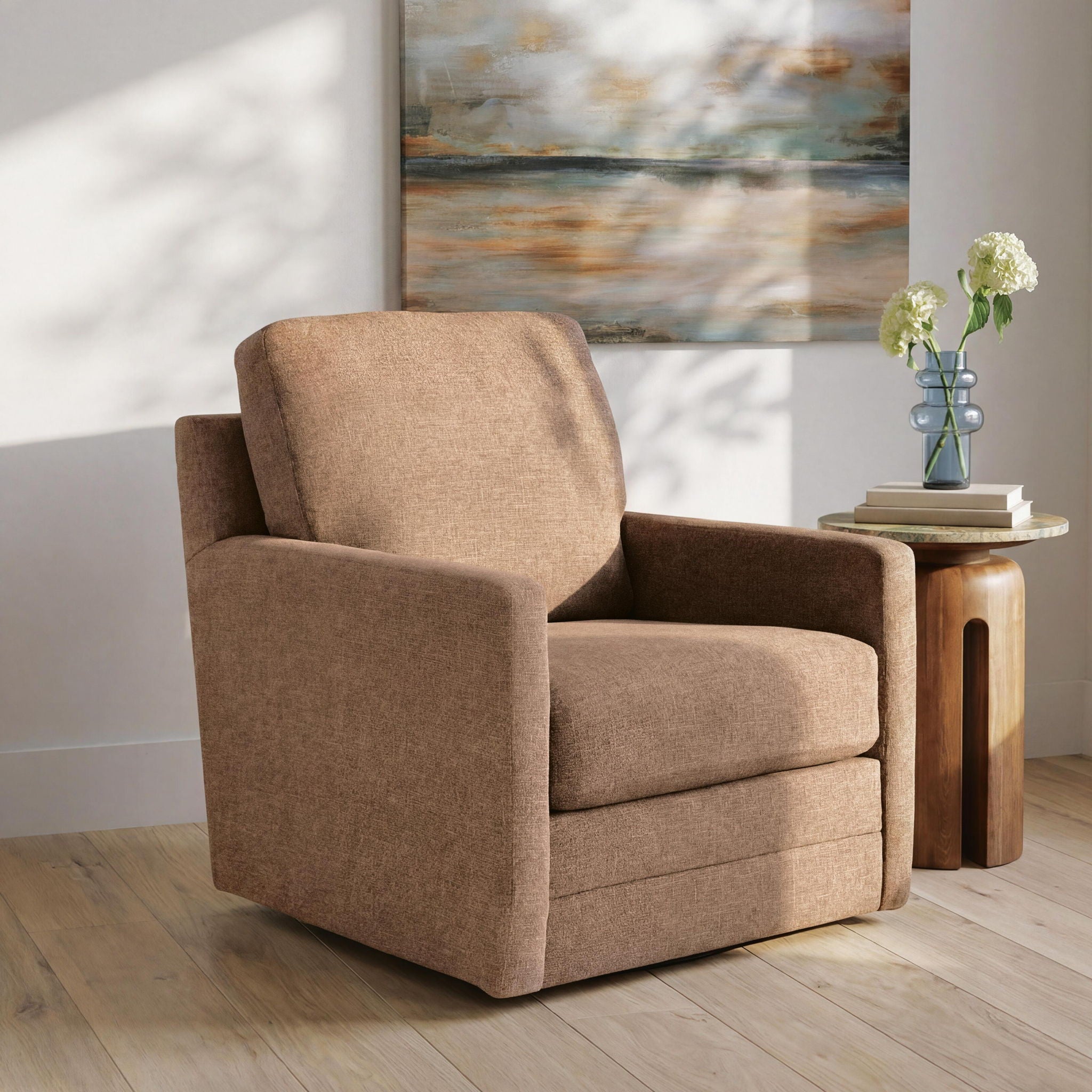 Light brown swivel accent chair with padded arms and tall backrest.