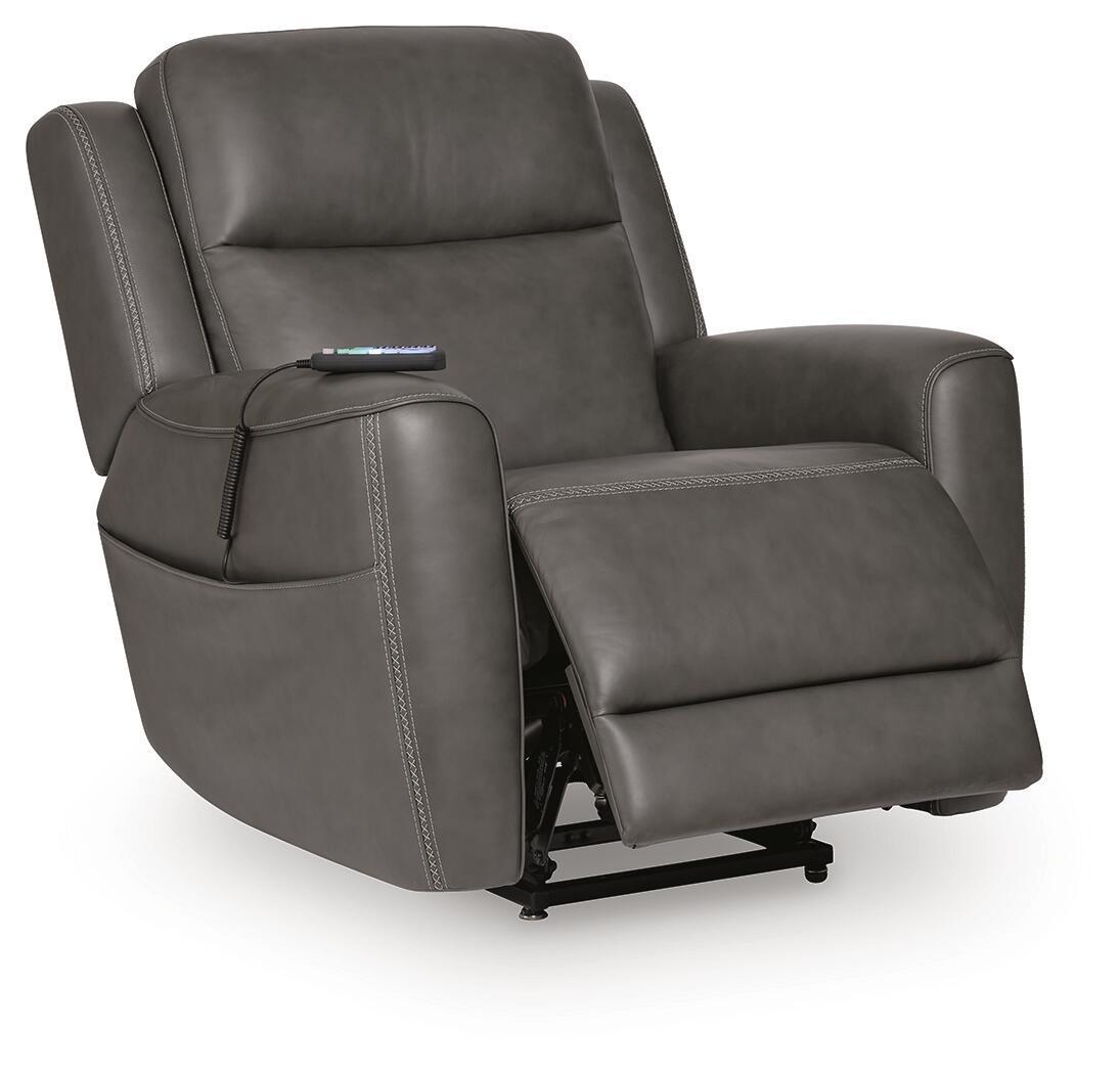Power lift recliner in dark gray faux leather, legrest extended on black base