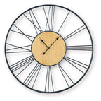 Black and natural wall clock with round wood dial, black metal rim, and metal hands