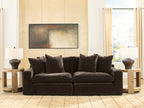Dark brown sectional sofa with two seat sections and plush back pillows