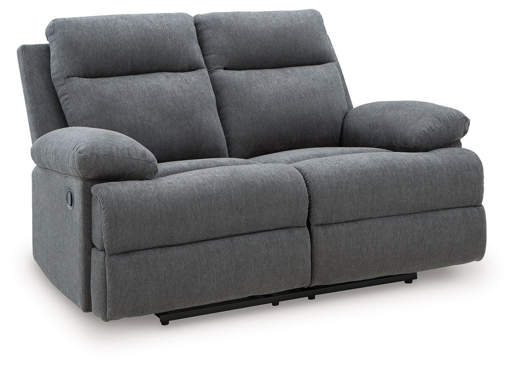 Dark gray reclining loveseat with padded armrests and two back cushions