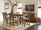Counter-height dining table set with cushioned stools, cross-back chairs, and dark wood server