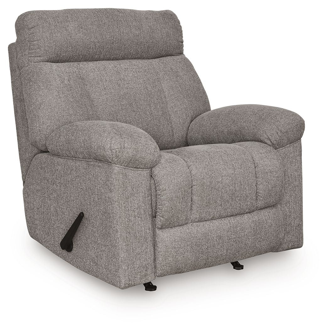 Rocker recliner chair in medium gray fabric, angled view with padded headrest
