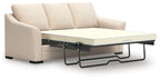 Queen sofa chaise sleeper with chaise pull-out bed frame, light beige upholstery and cushions