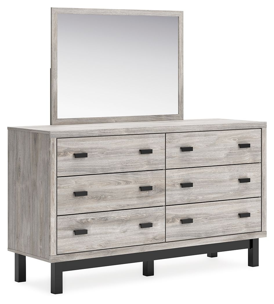 Gray dresser with mirror, six drawers with black bar pulls, wood-look finish