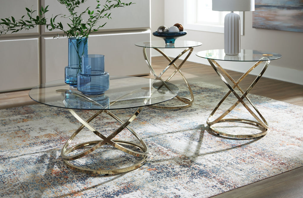 Round occasional tables set with clear glass tops and champagne crossed metal legs