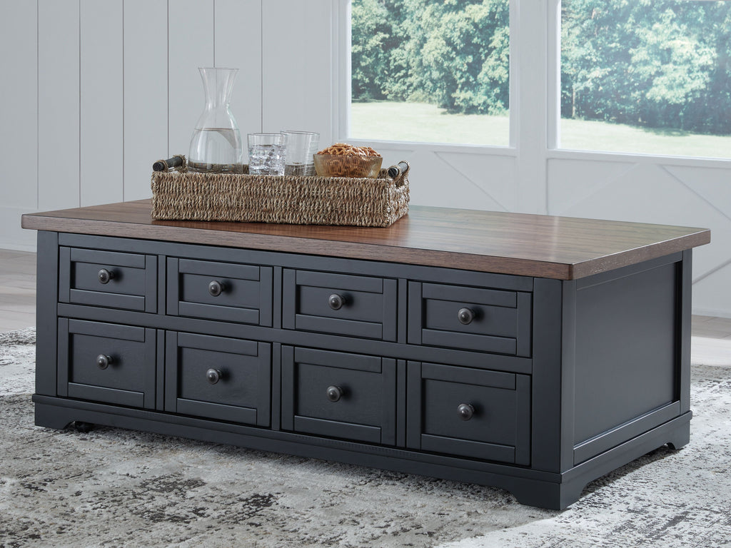 Brown lift-top cocktail table with multiple black drawers and knob pulls