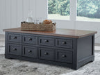 Brown lift-top cocktail table with multiple black drawers and knob pulls