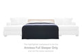 Armless full sleeper with dark upholstered cover and white accent pillows