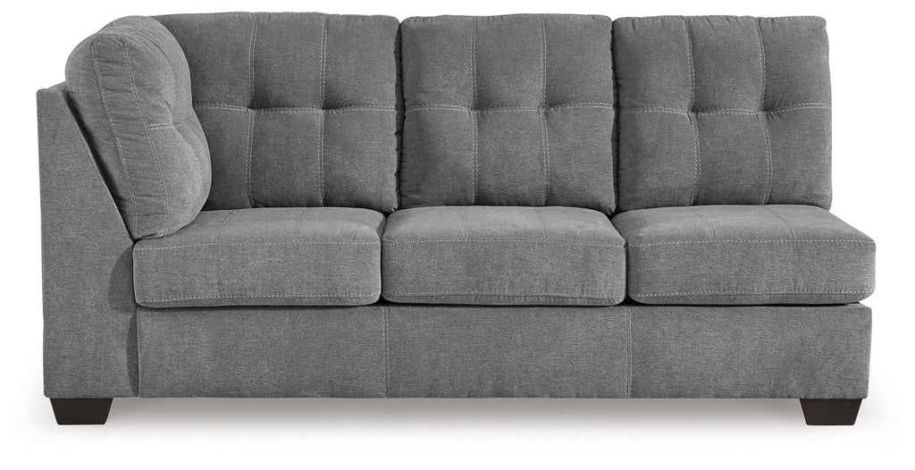 Gray tufted-back sofa with three seat cushions, square arms, and dark legs