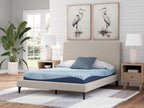 Blue memory foam mattress on bed frame with patterned top and dark edge