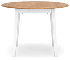 Round drop-leaf dining table with fully extended light wood top and white legs