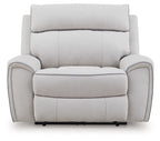 Light gray power recliner chair, straight front view with wide padded arms